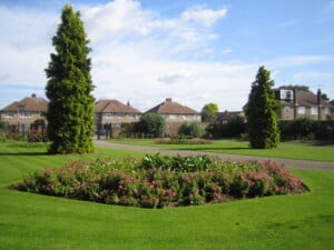 Cedars Park in Cheshunt, a landscaped public park with flower beds and mature trees